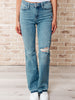Isla Mid Rise Distressed Released Hem Bootcut Jeans